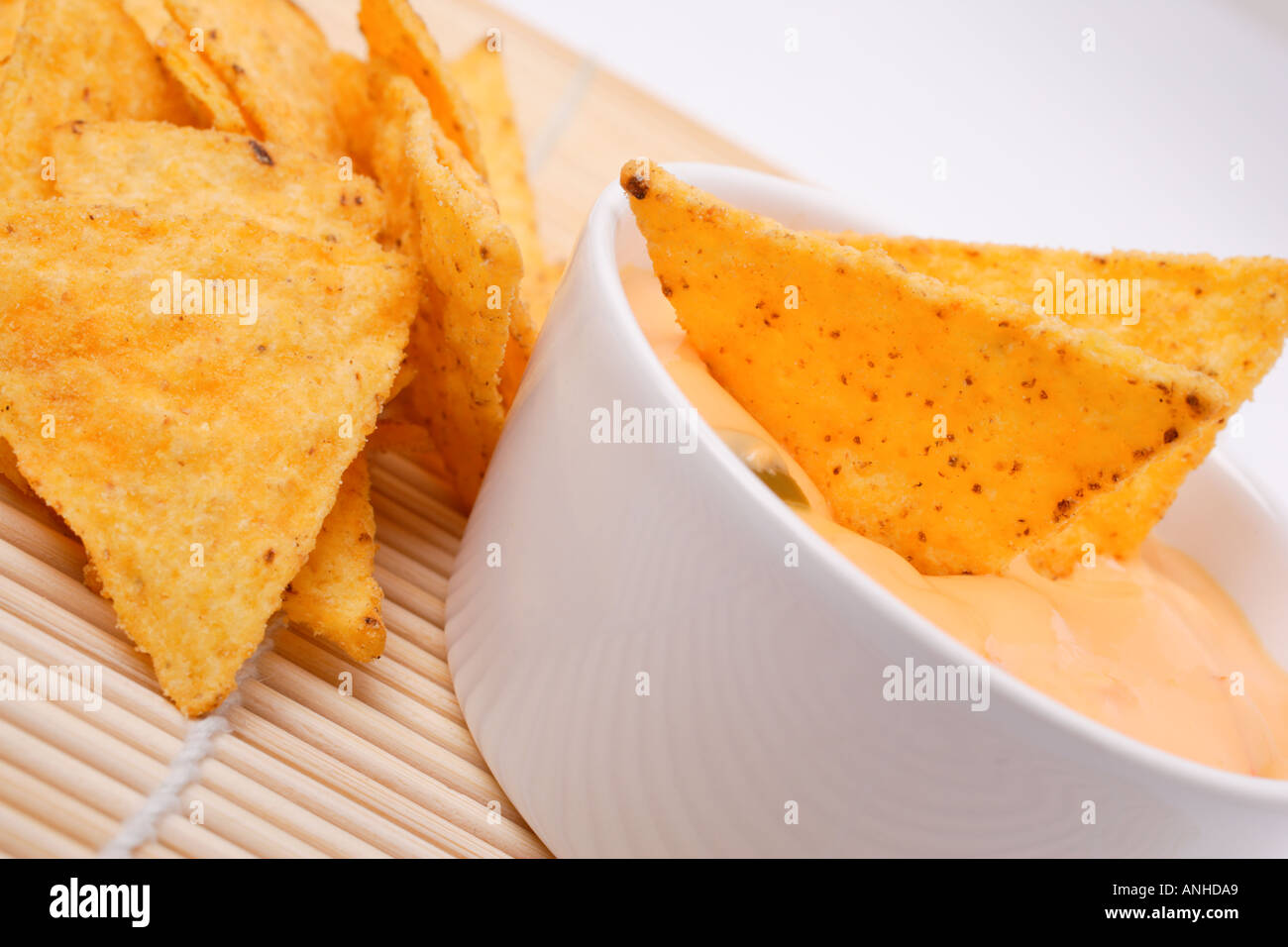 Tortilla chips and cheese dip Stock Photo Alamy