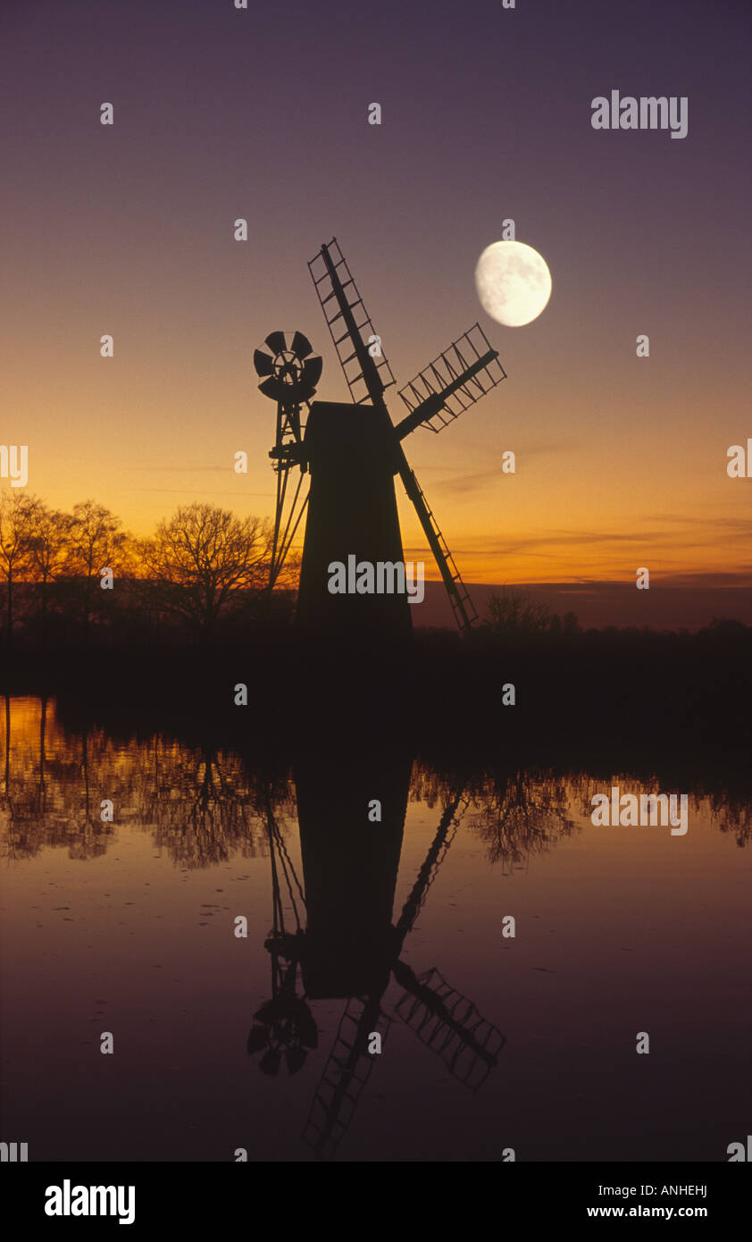 Turf Fen Windmill at Sunset with Rising Moon Stock Photo