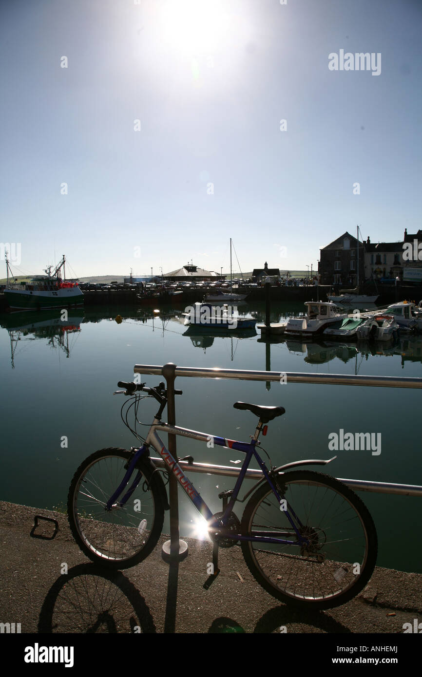 Bike against railings at Padstow Harbour cornwall Stock Photo Alamy