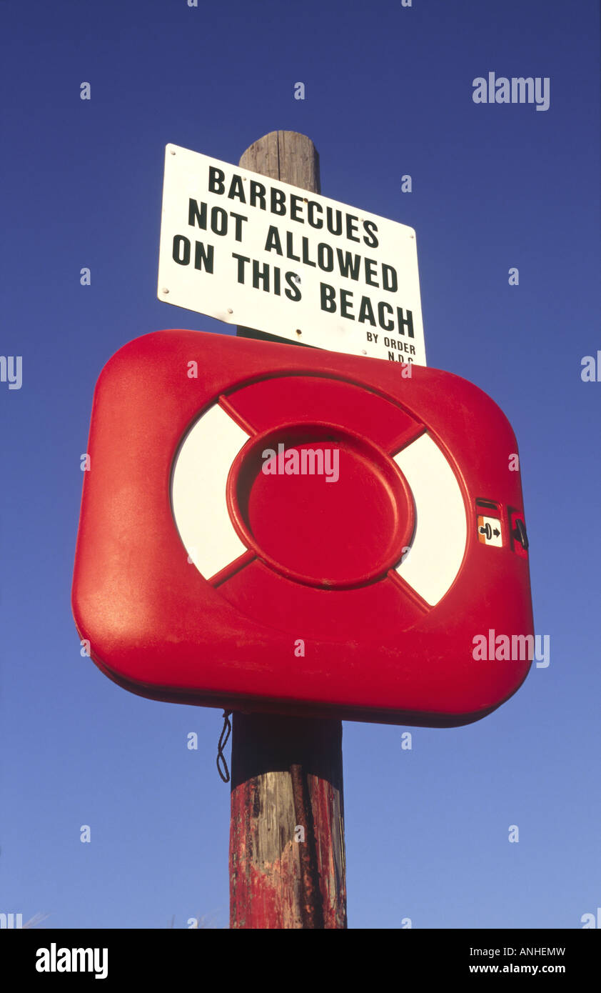 Red Enclosure on Beach Containing Life Saving Ring Stock Photo