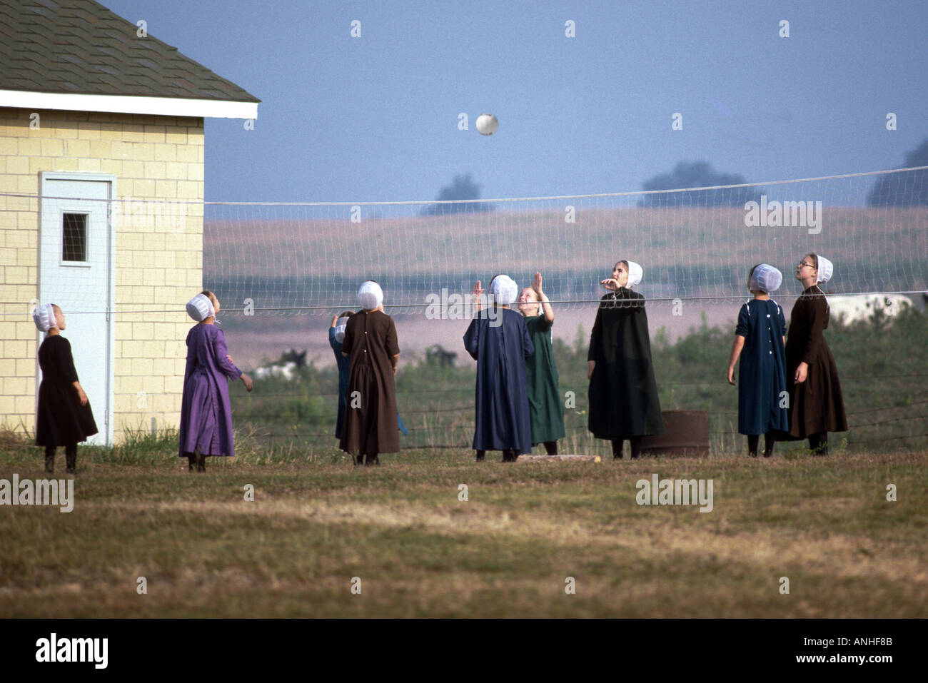 Amish school girls play volleyball in a school yard Shipshewana Indiana Stock Photo