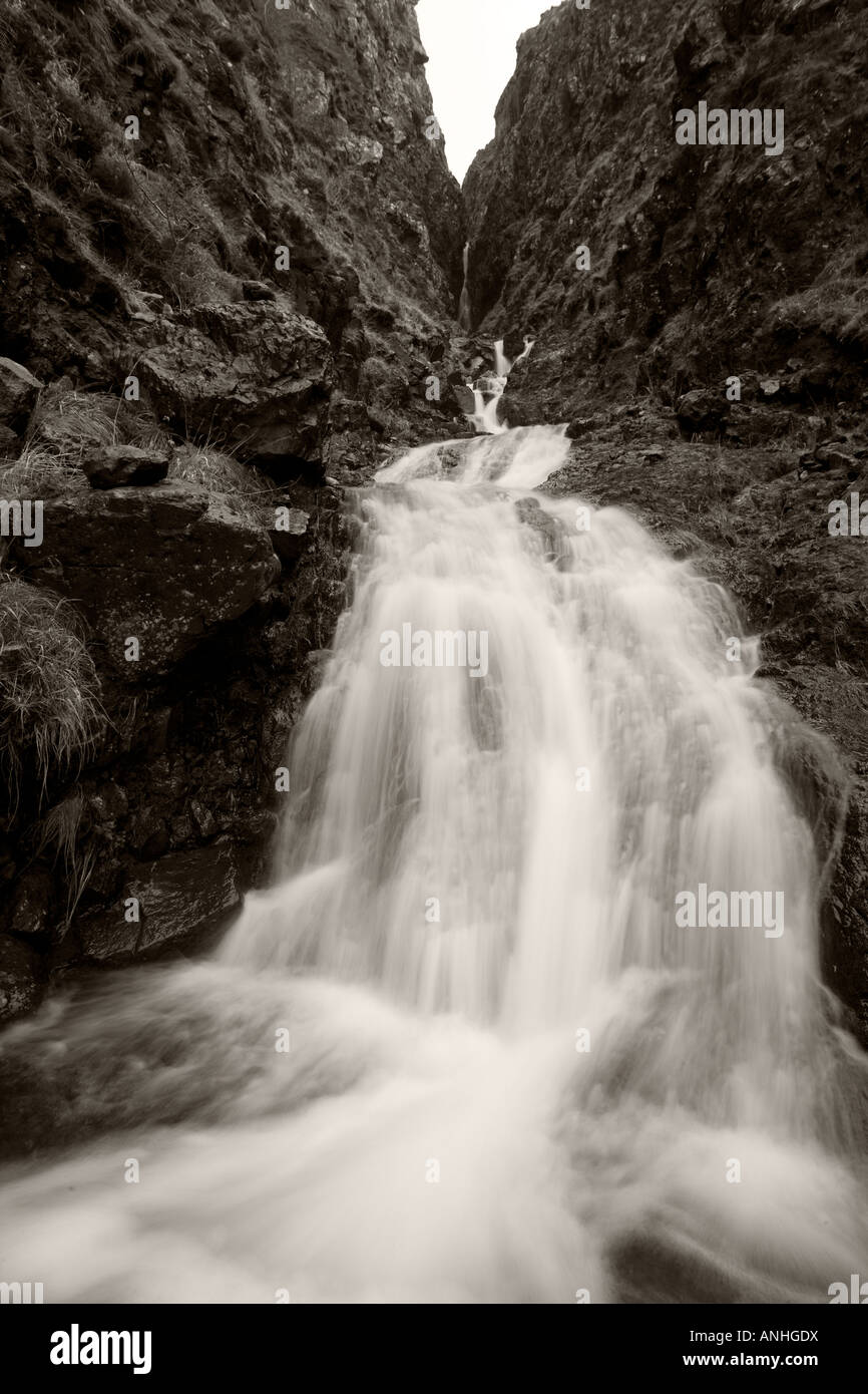 Waterfall rushing down from mountain Stock Photo - Alamy