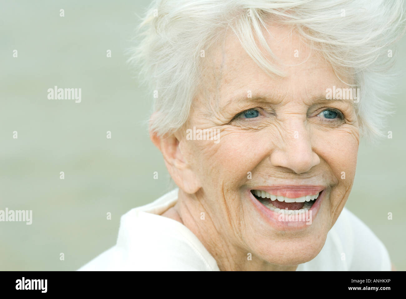 Senior woman smiling, looking away, portrait Stock Photo