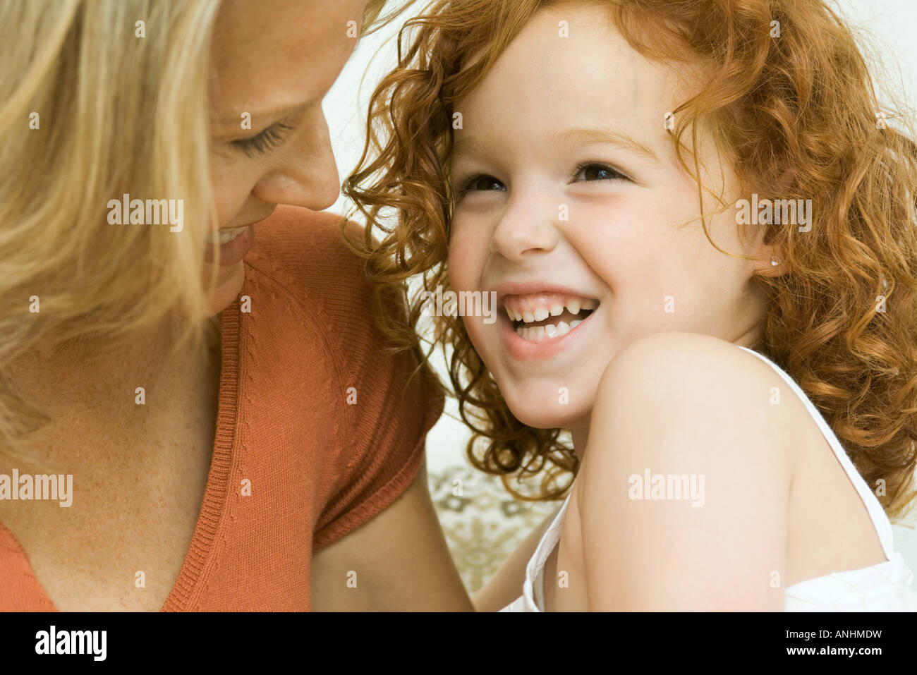 Mother and daughter laughing together, close-up Stock Photo