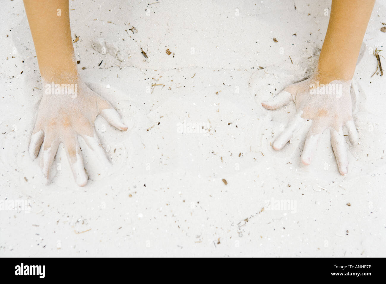 Child making hand prints in sand, cropped view of hands Stock Photo - Alamy