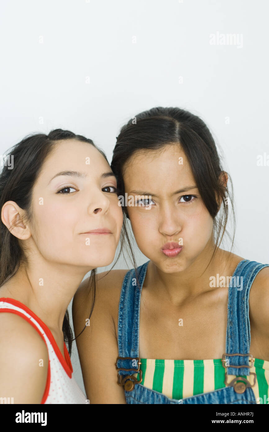 Two young friends making faces at camera Stock Photo