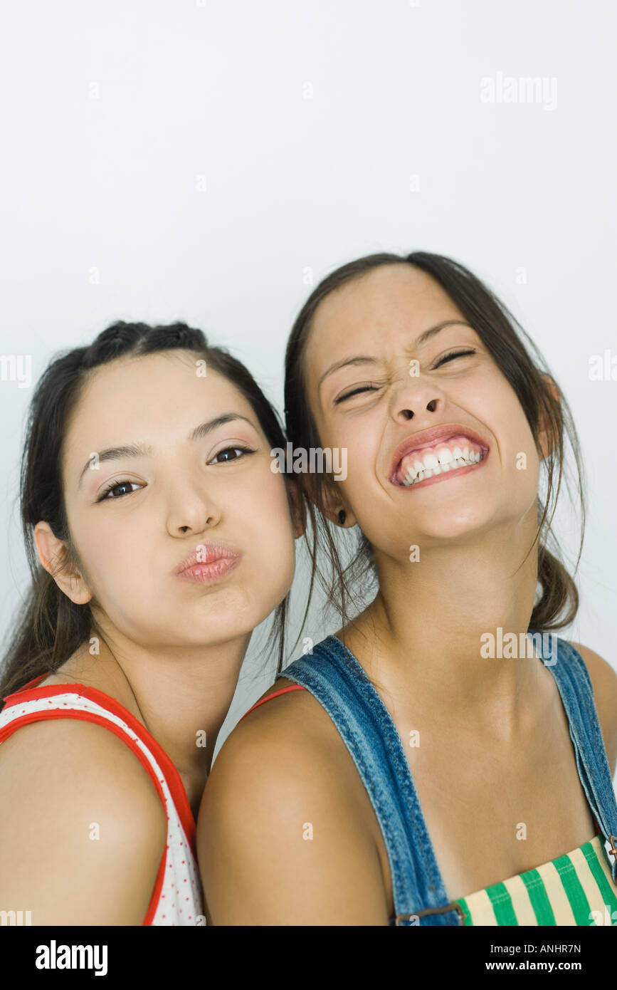 Two young friends making faces at camera, portrait Stock Photo