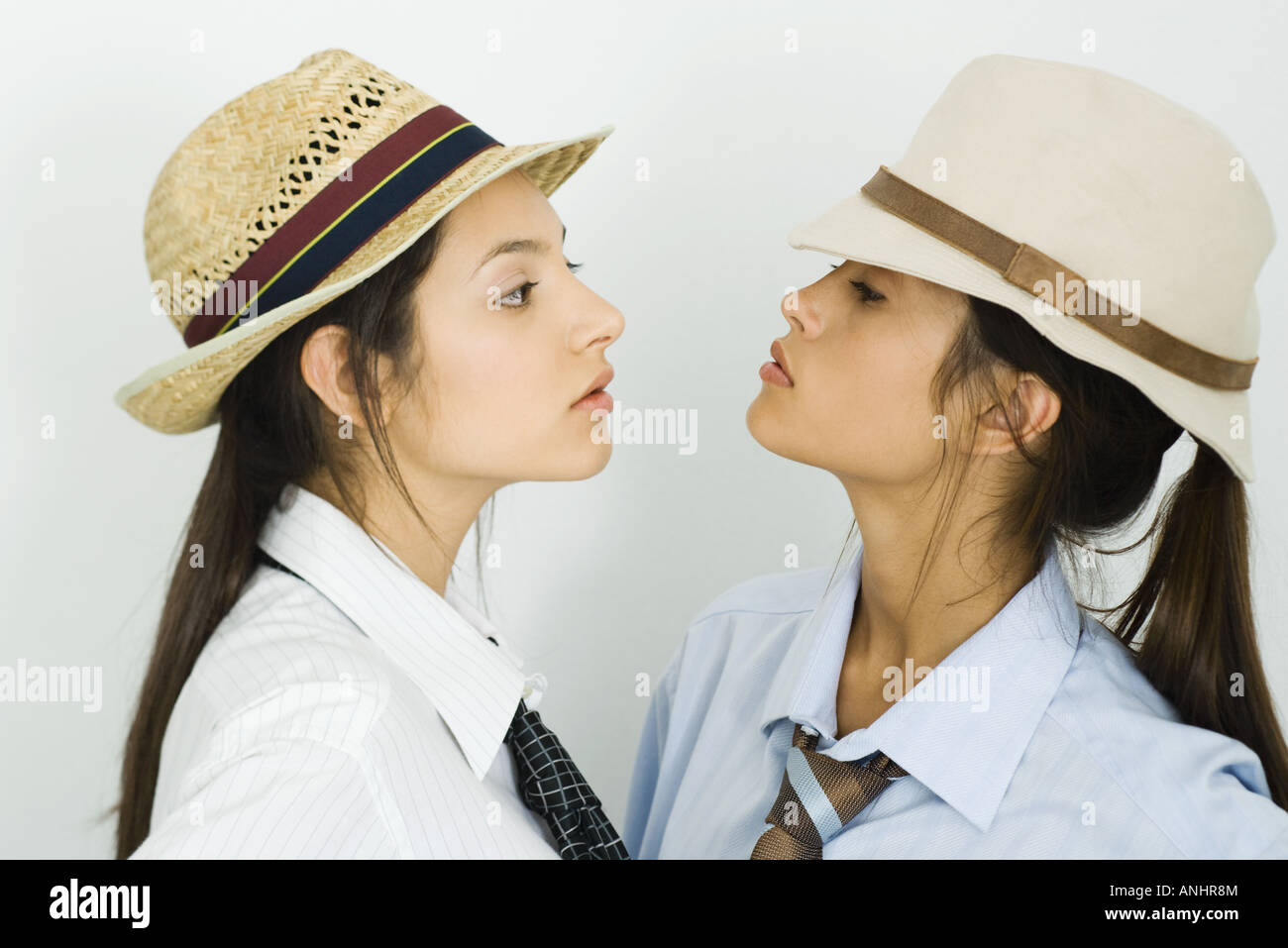 Two girls hats looking down hi-res stock photography and images - Alamy