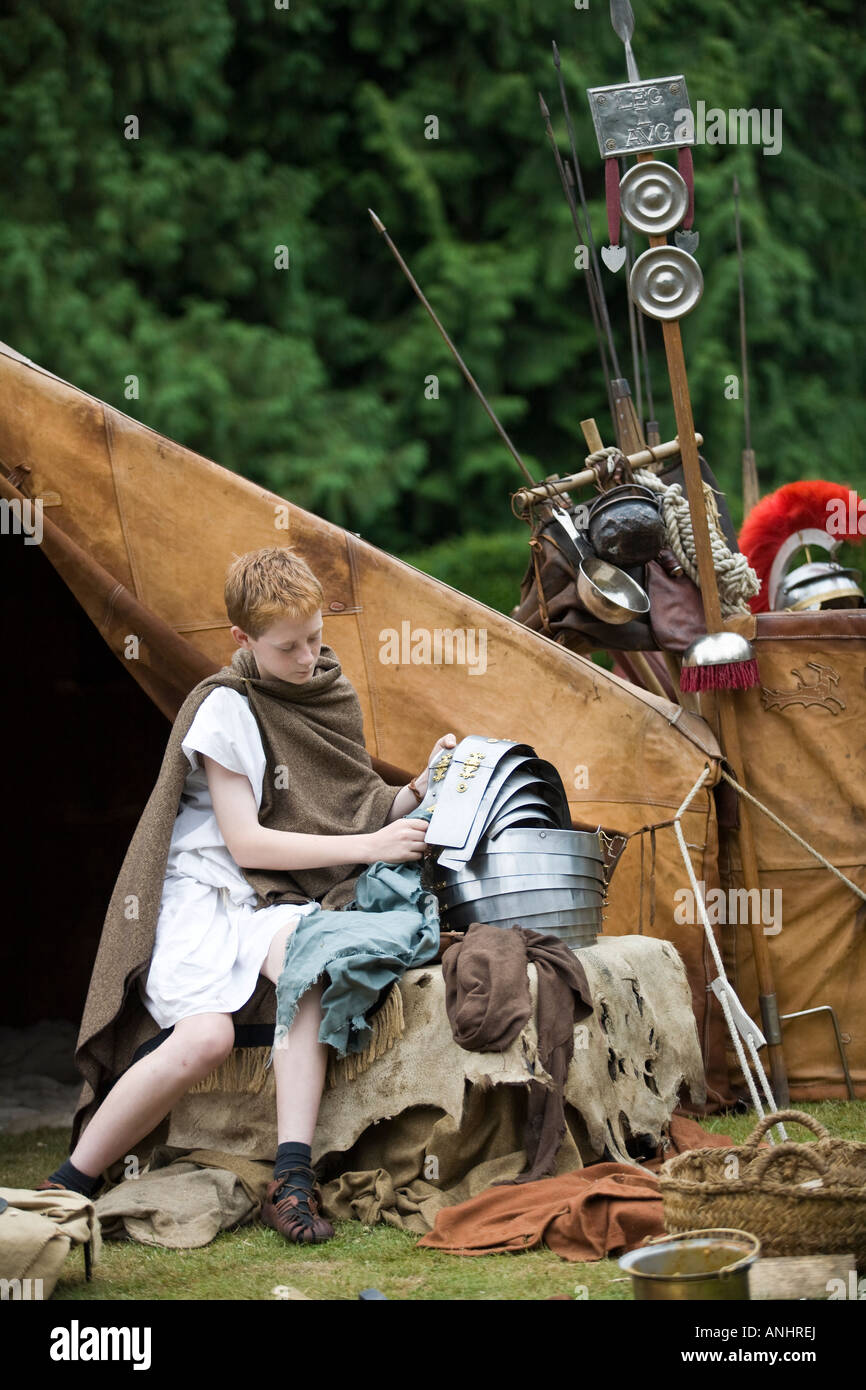 Boy dressed as a Roman Briton with Roman Army equipment at Roman Army reenactment Stock Photo