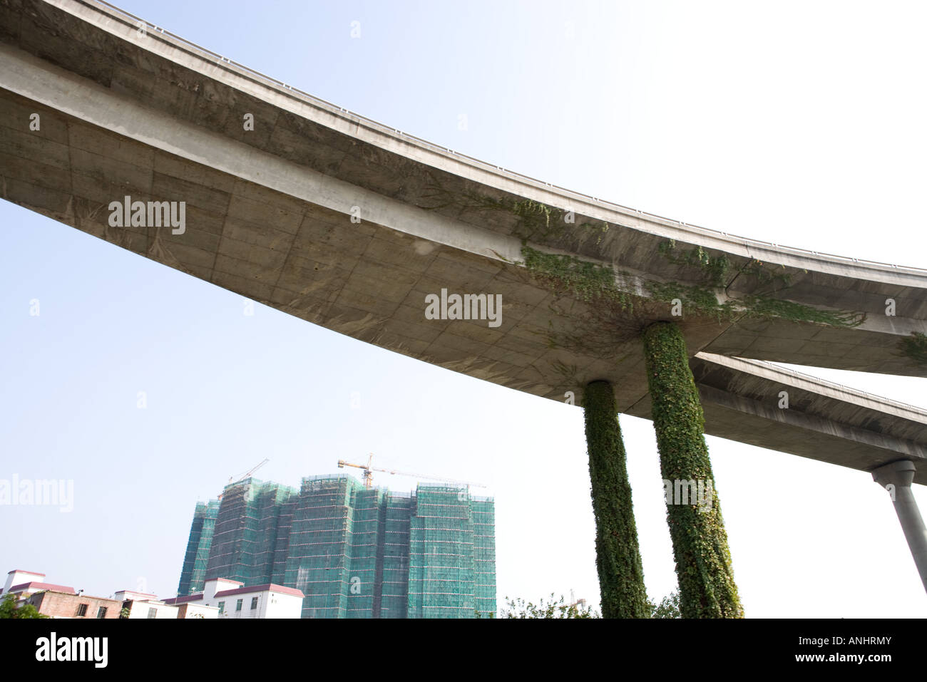 Overpass, high rises with scaffolding in background Stock Photo