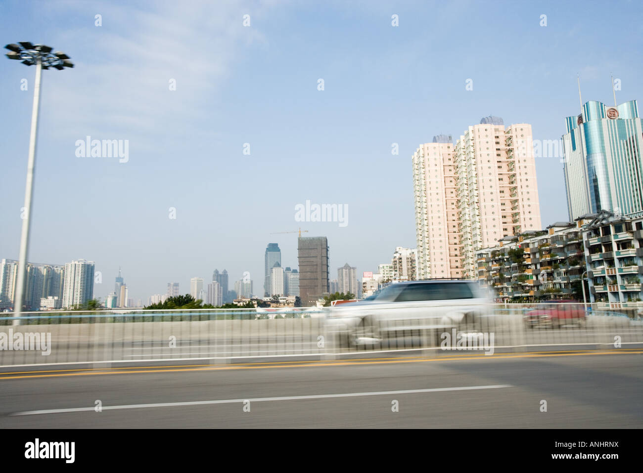 Road and cityscape, blurred motion Stock Photo
