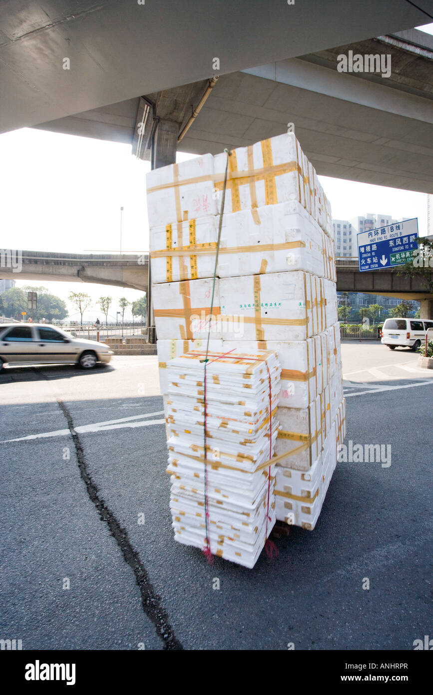 Stack of polystyrene boxes on asphalt Stock Photo