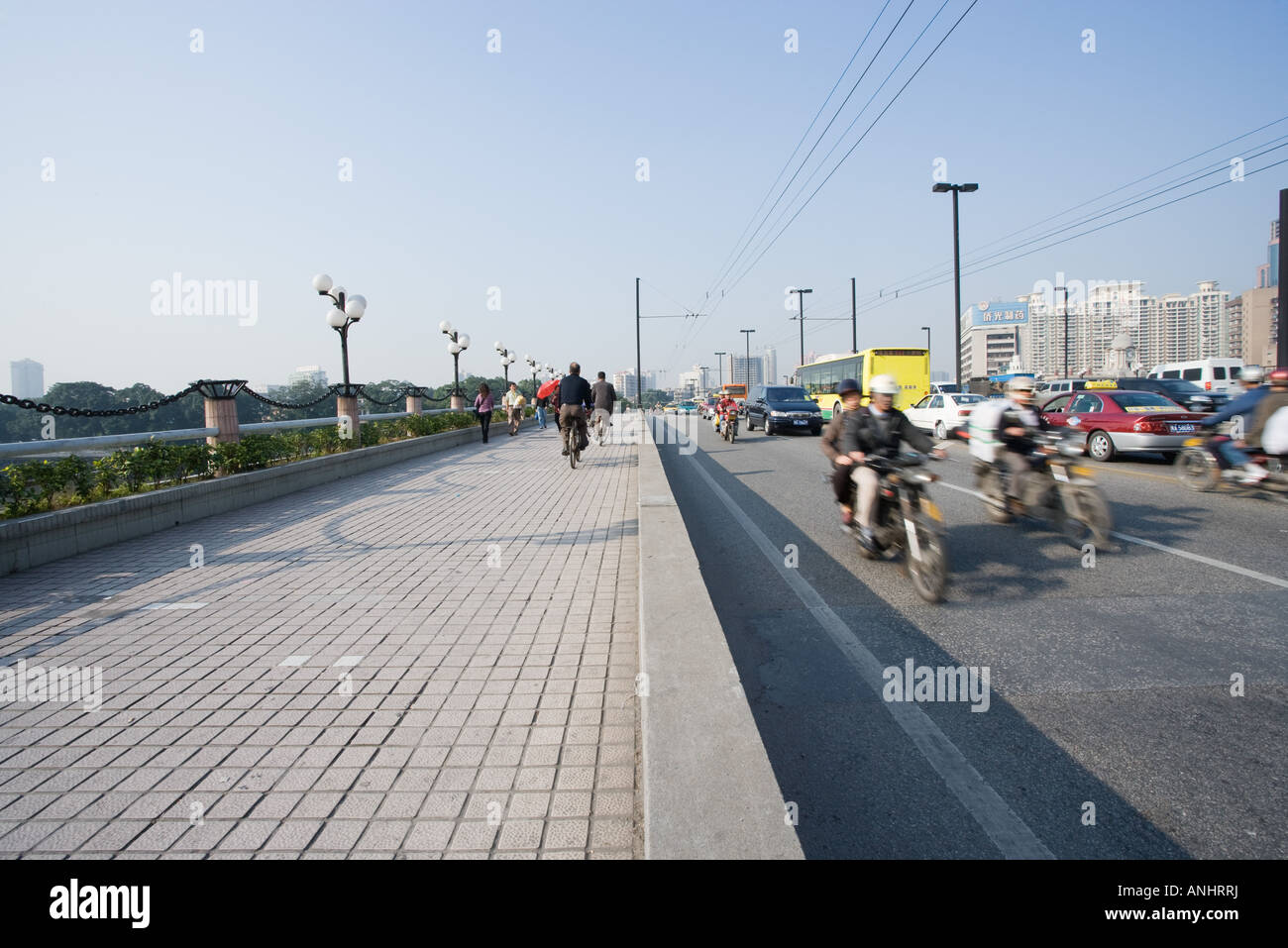 Pedestrian lane next to city thoroughfare, China Stock Photo