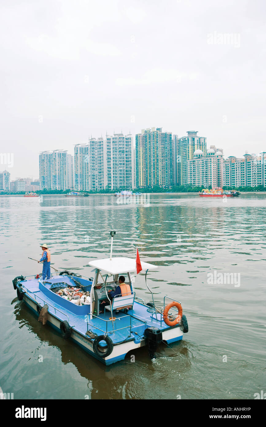 Garbage boat cleaning river Stock Photo Alamy