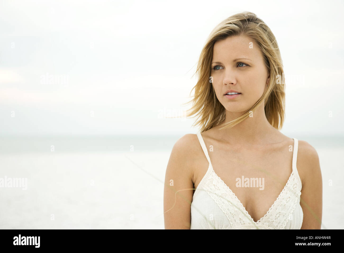Woman looking away on beach hi-res stock photography and images - Alamy