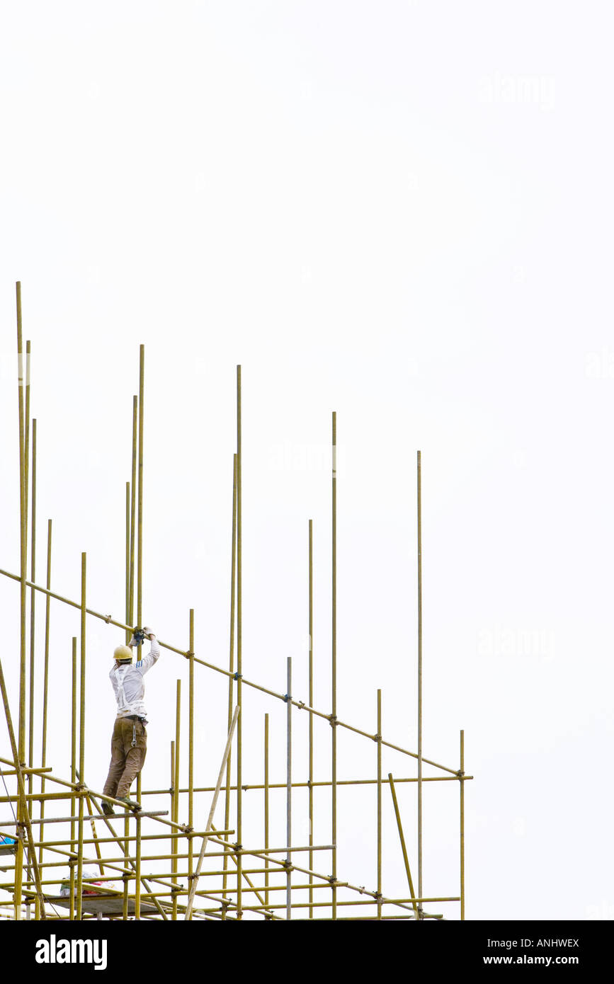 Construction worker working at construction site Stock Photo - Alamy
