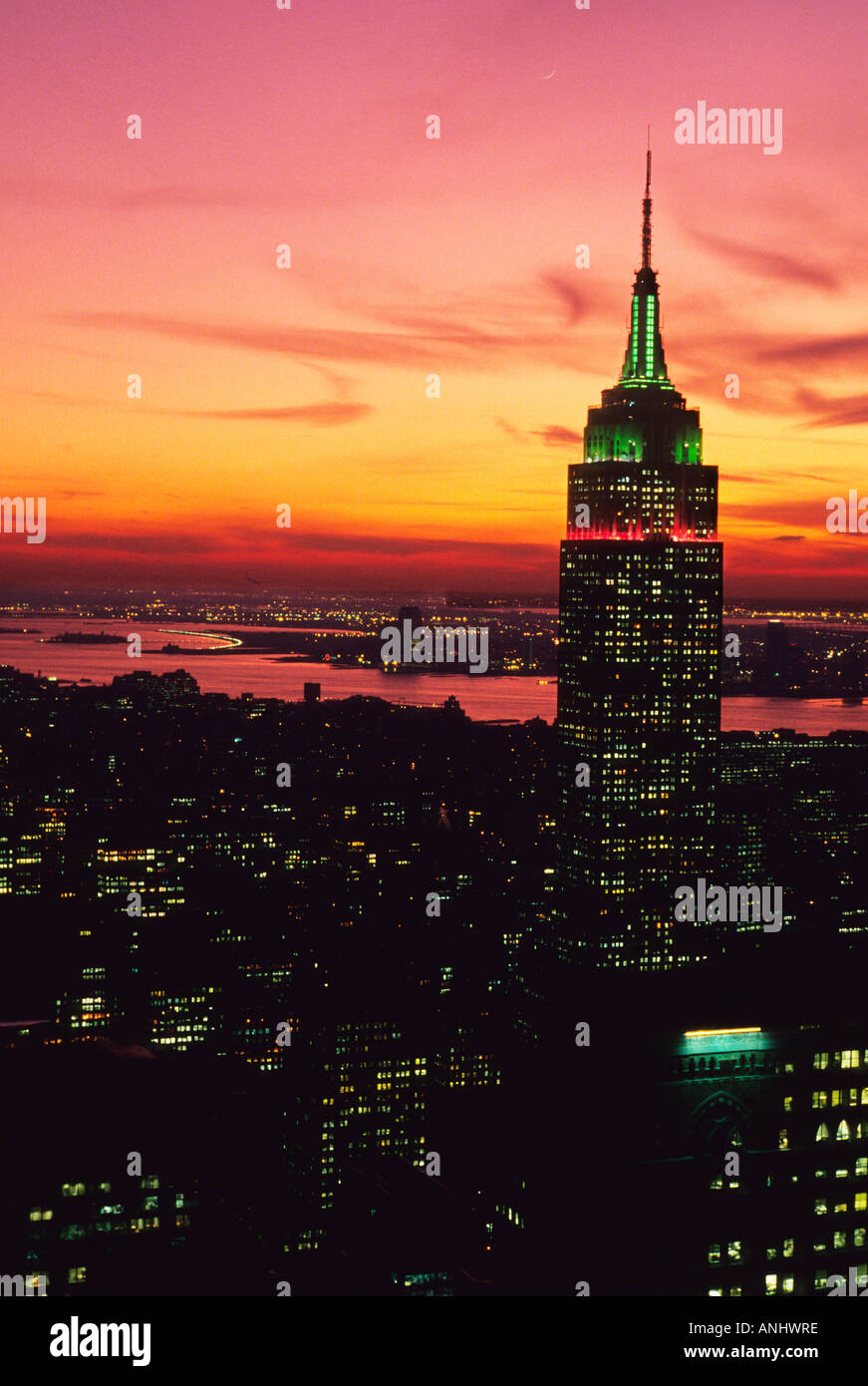 New York City USA The Empire State Building at sunset illuminated with ...