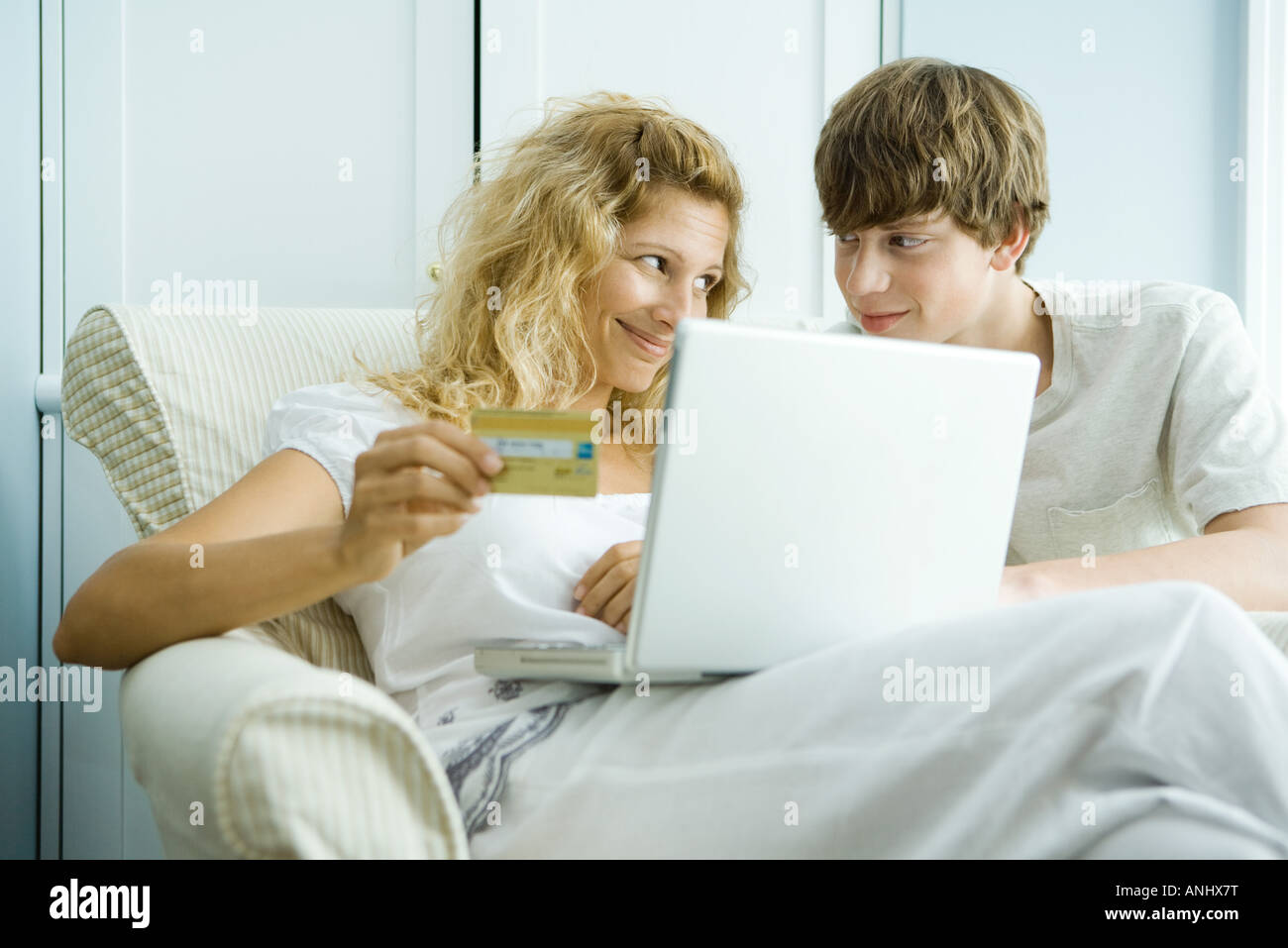 Teenage boy shopping online for clothes hires stock photography and