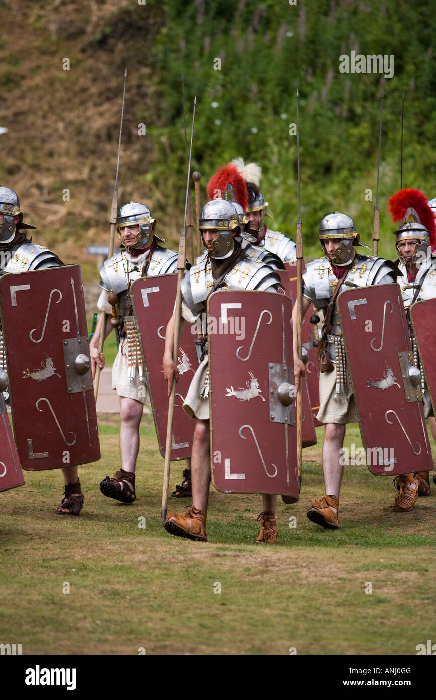 Roman soldiers in formation with shields and weaponry at a Roman army reenactment,  Chedworth Villa, Gloucestershire, UK Stock Photo