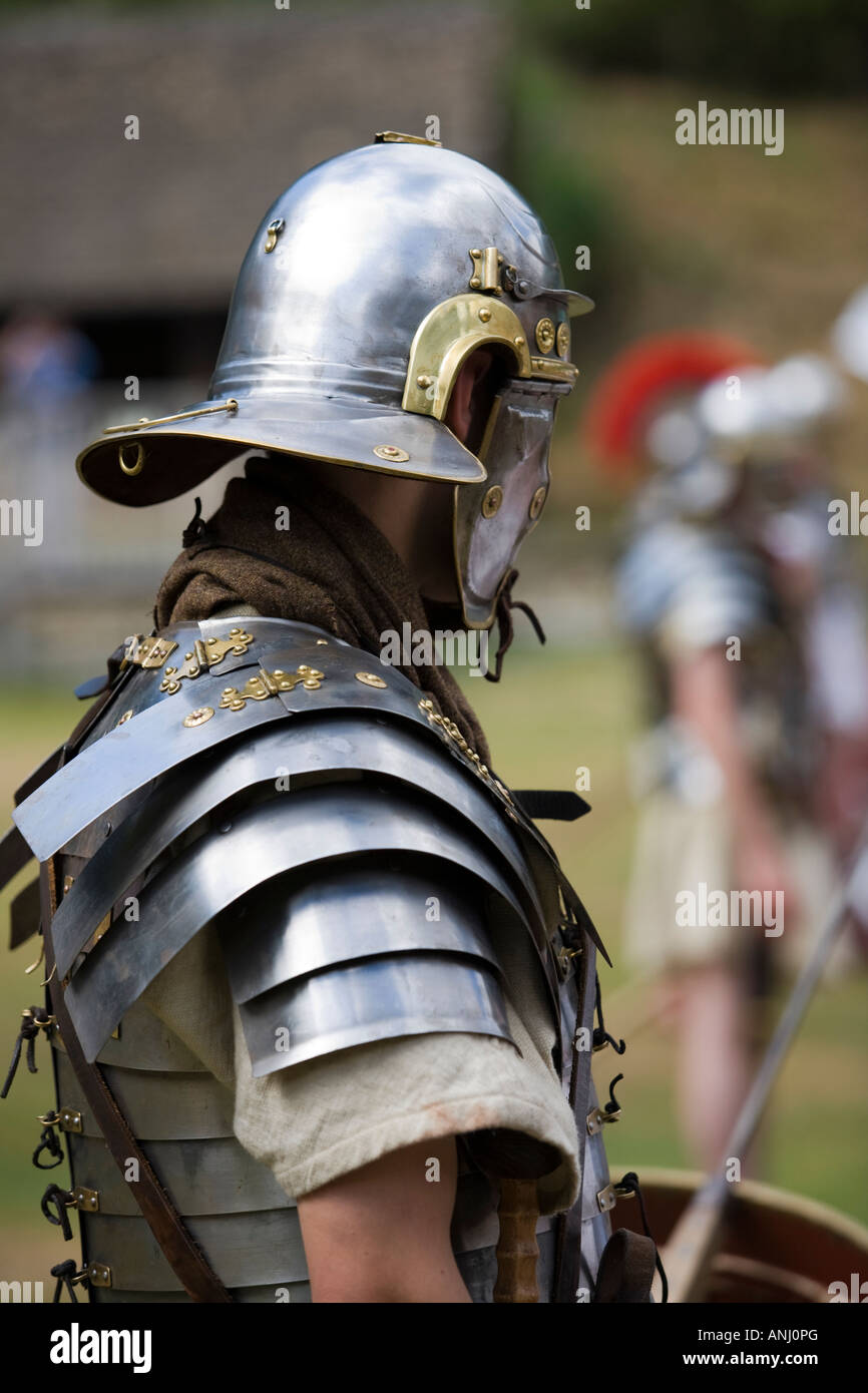 Roman soldier with shields and weaponry at a Roman army reenactment,  Chedworth Villa, Gloucestershire, UK Stock Photo