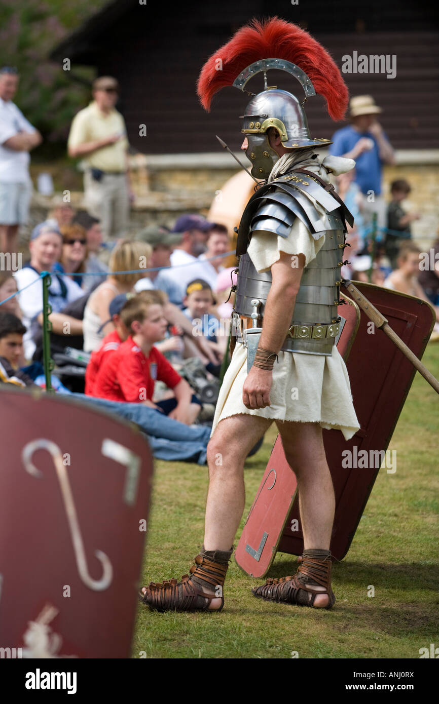 Roman soldier with shields and weaponry at a Roman army reenactment,  Chedworth Villa, Gloucestershire, UK Stock Photo