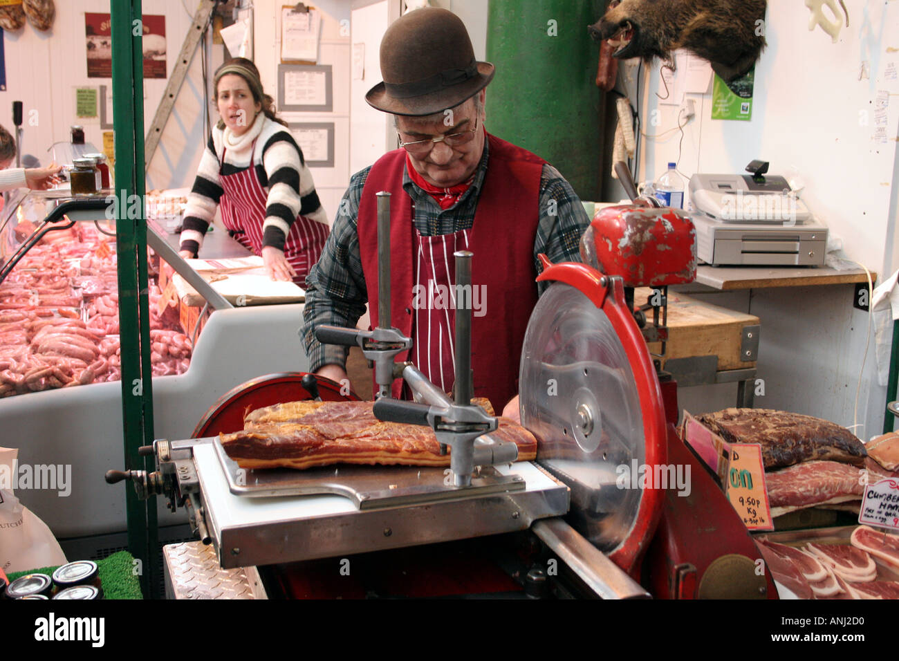 Butcher carving meat at Borough market London Stock Photo 2876111 Alamy