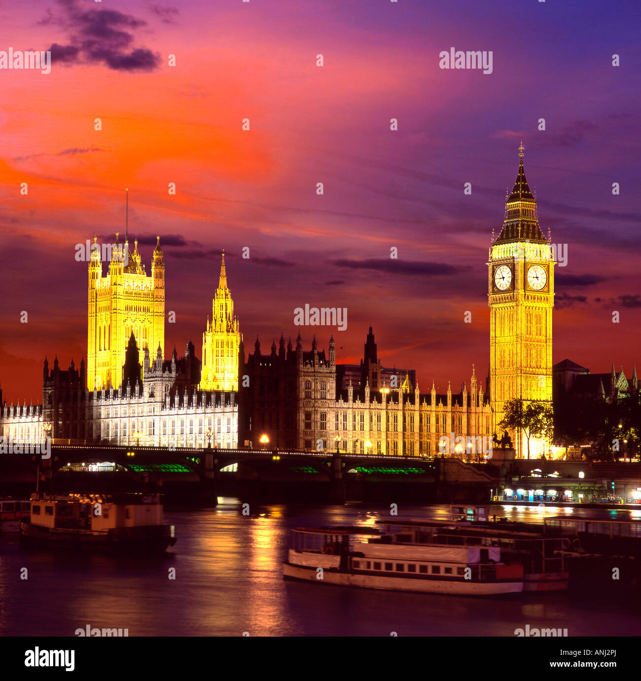 View of the The Houses of Parliament at night across River Thames. Stock Photo