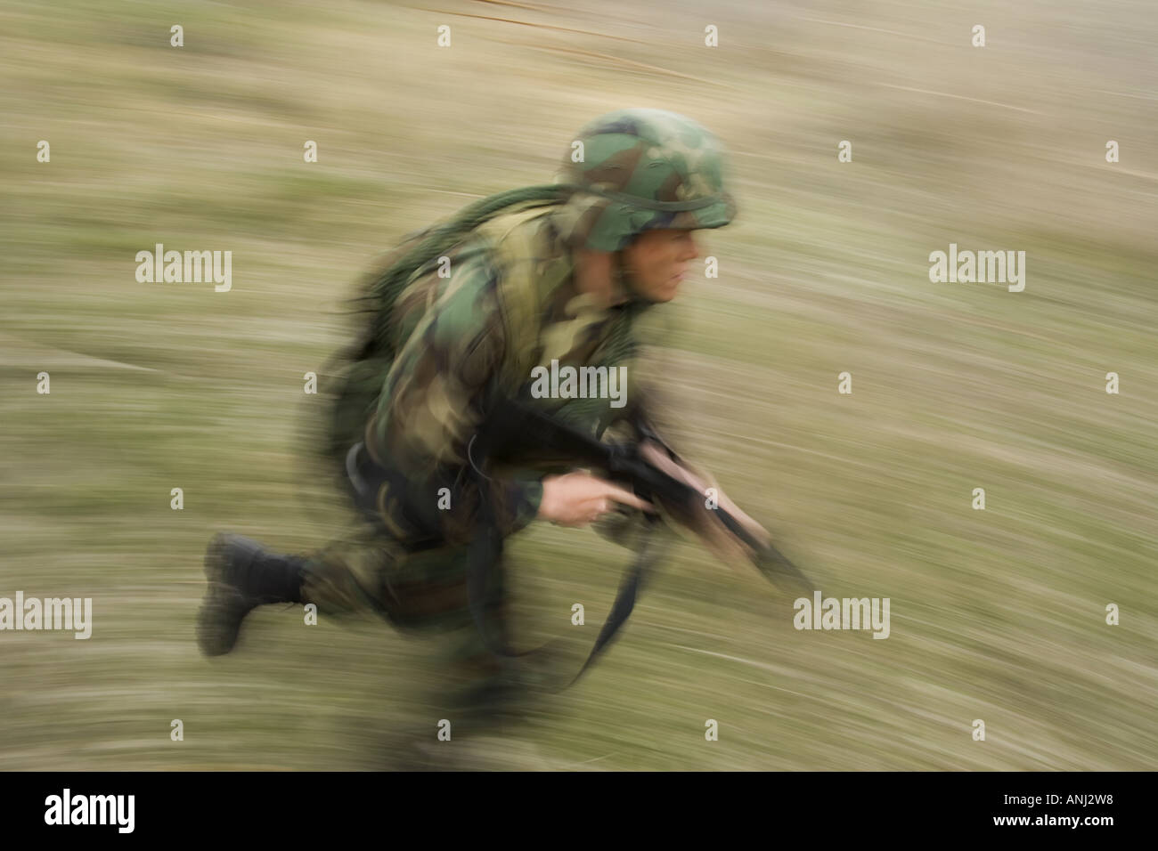 Side profile of a soldier running Stock Photo