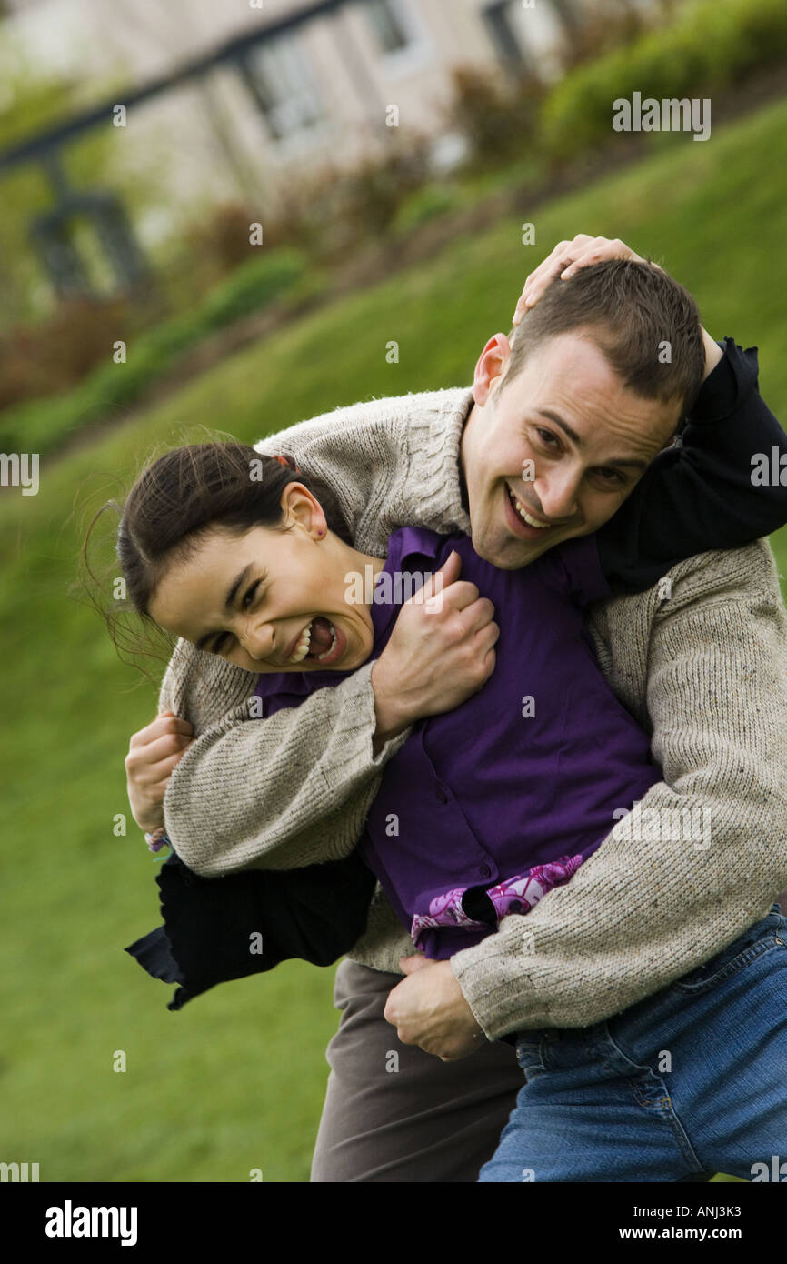 Portrait of a father with his daughter in a park Stock Photo - Alamy