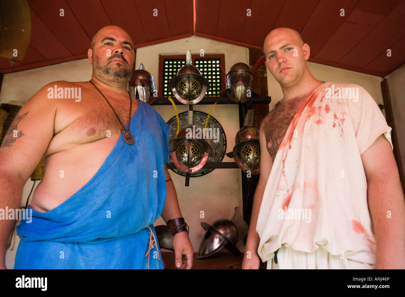 Two reenactors dressed as Roman age Gladiators, Chedworth Villa, Gloucestershire, UK Stock Photo