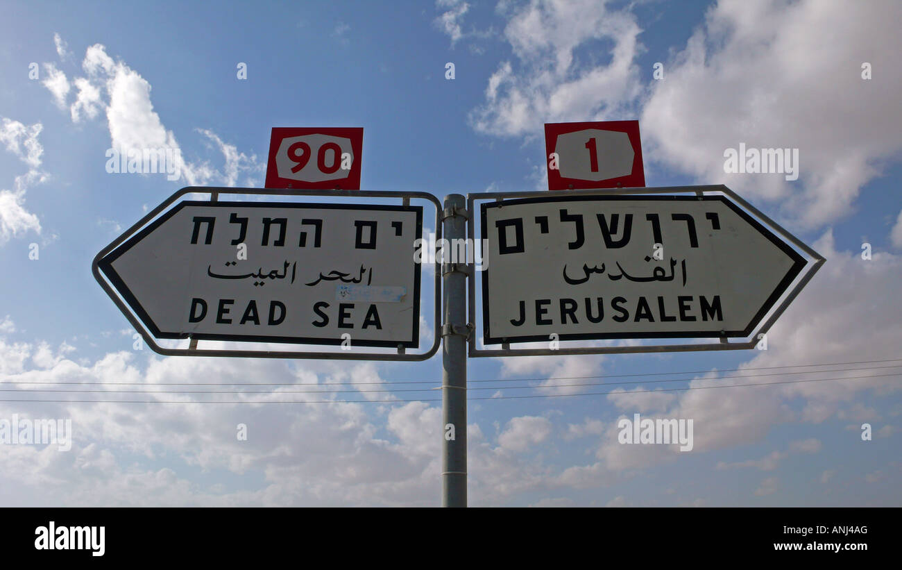 Road sign in Hebrew, Arabic and English between the Dead Sea and Jerusalem in the West Bank Stock Photo