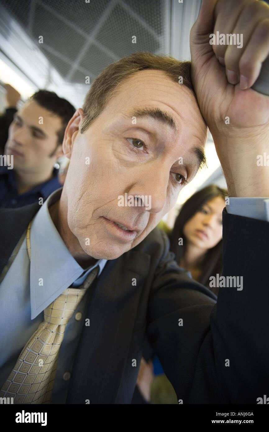 Close up of a man traveling on a passenger train Stock Photo