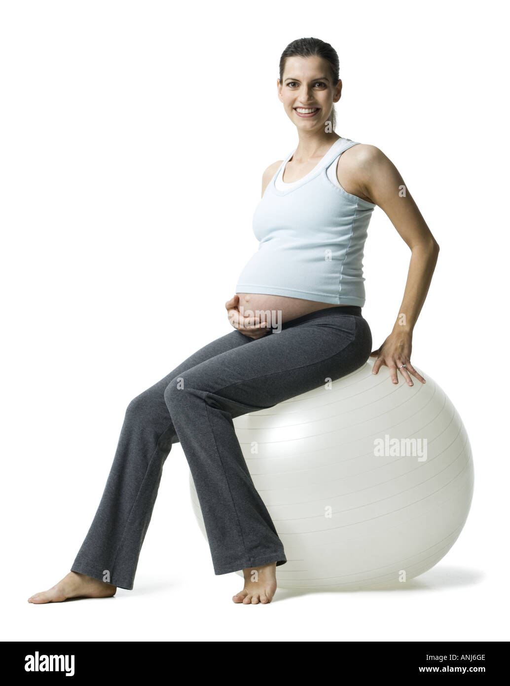 Portrait of a pregnant woman sitting on a fitness ball Stock Photo