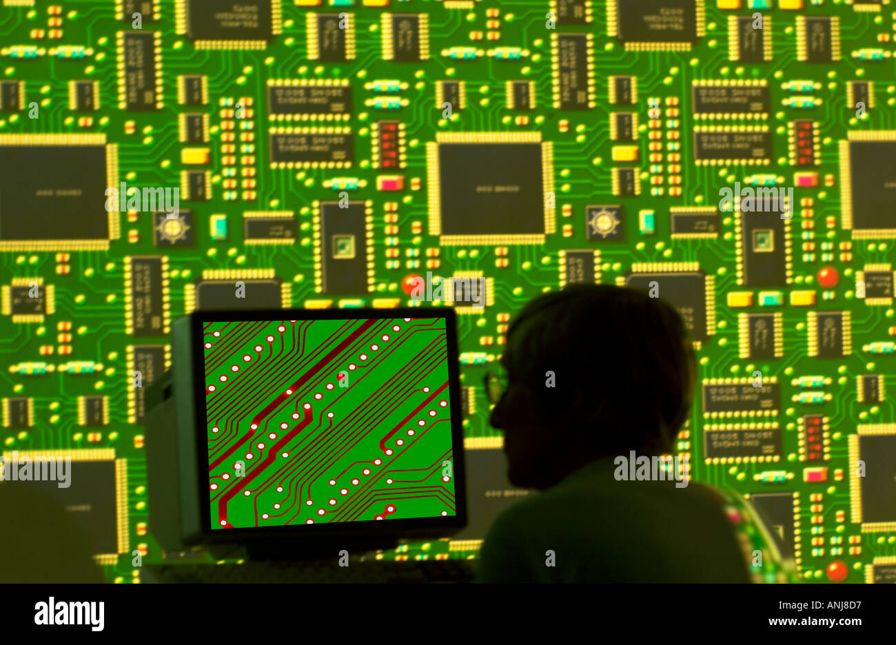 computer engineer with circuit board image on monitor Stock Photo Alamy