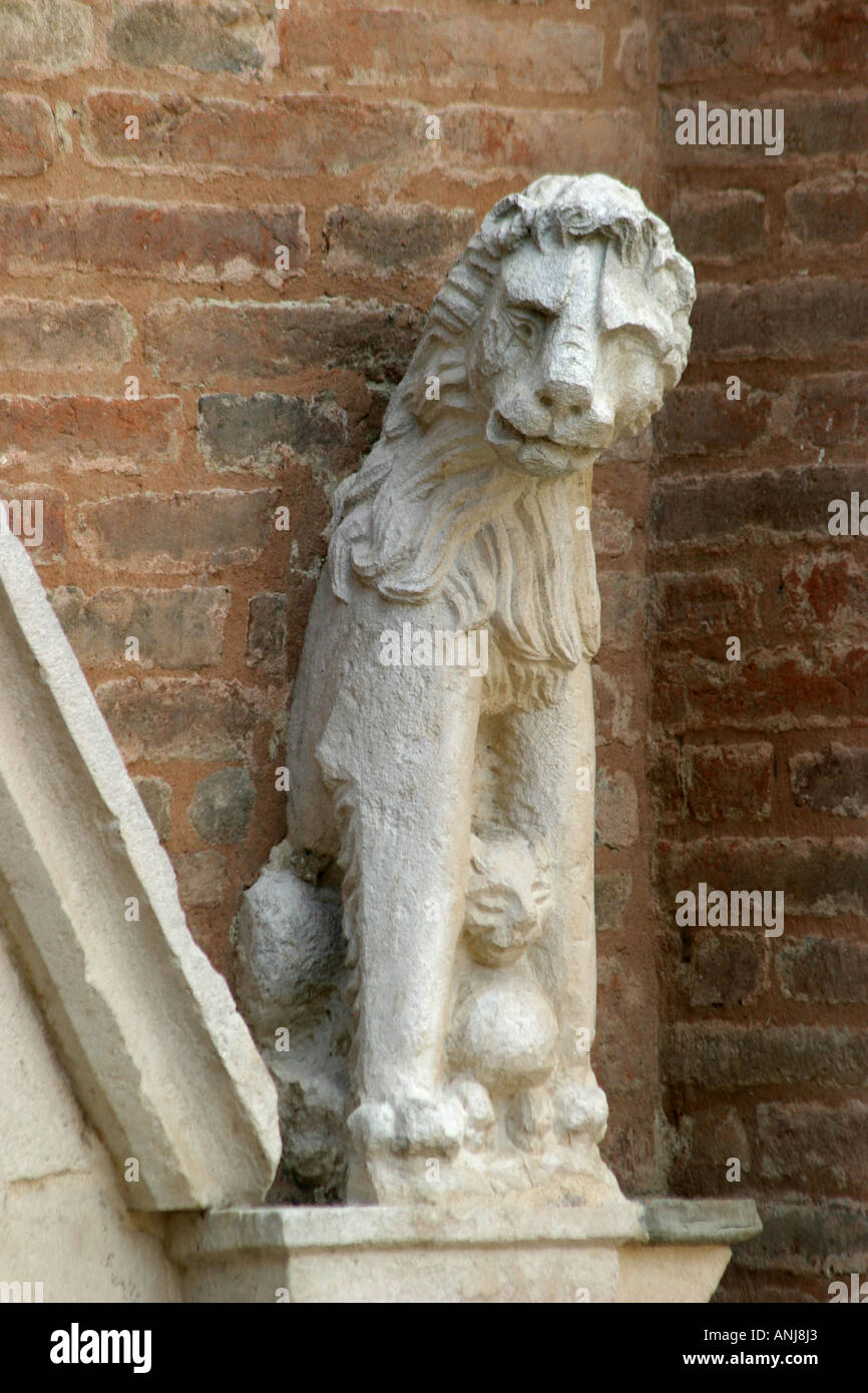 charming  carving of lion and cub on the portal  of the church of St Agostino (15th century)  in Amandola le Marche Stock Photo