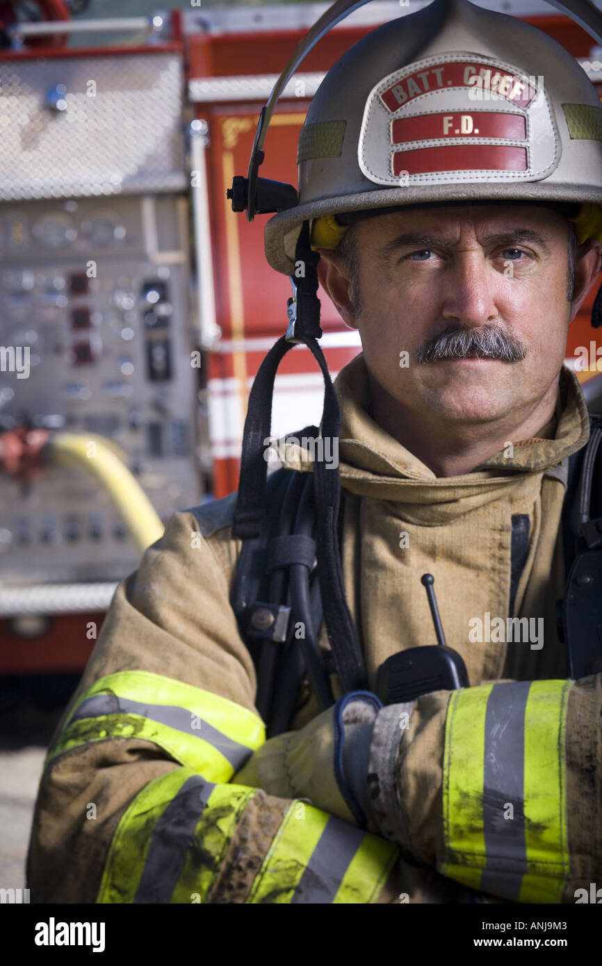 Close up of a firefighter with his arms crossed Stock Photo