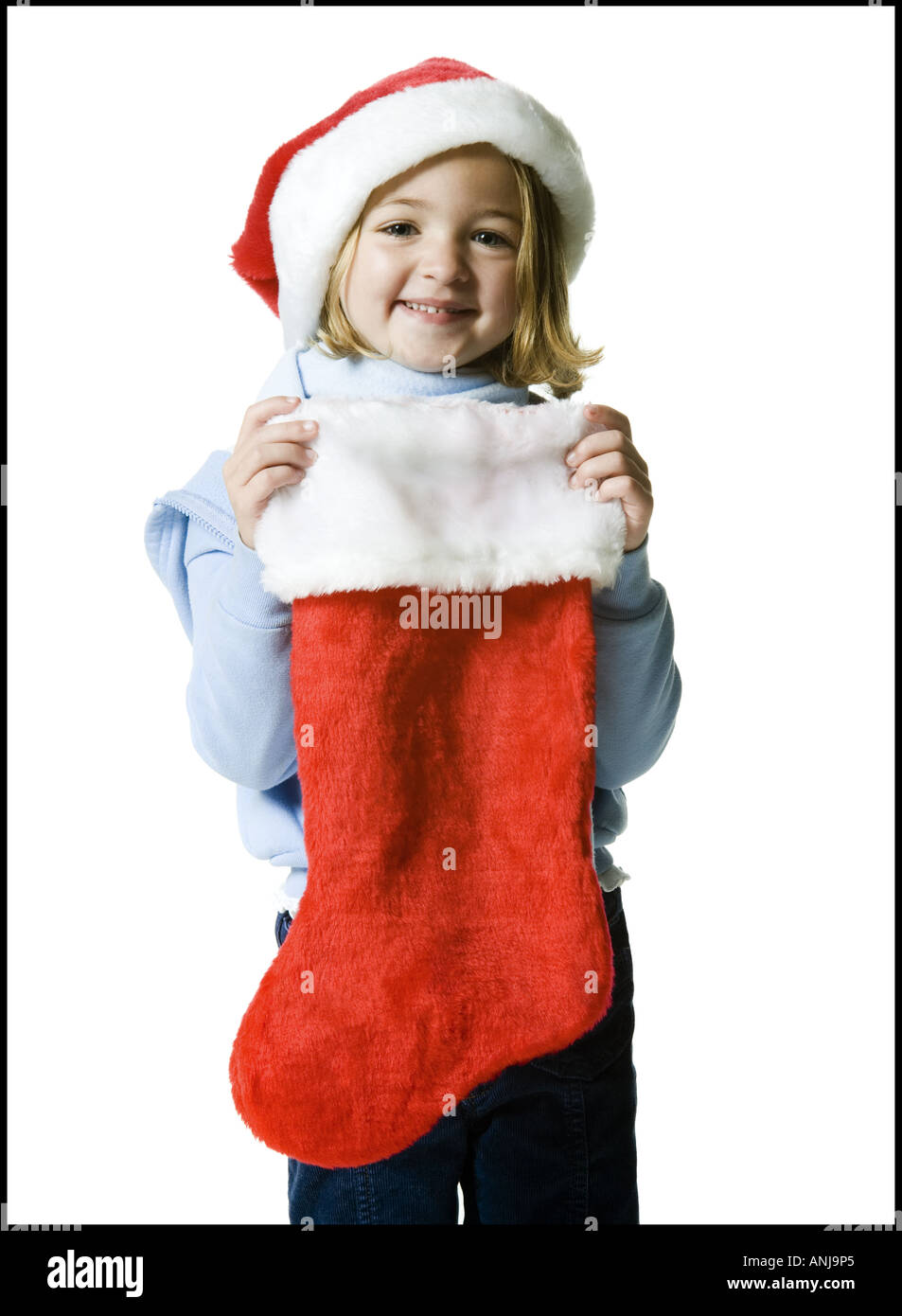 Portrait of a girl holding a Christmas stocking Stock Photo
