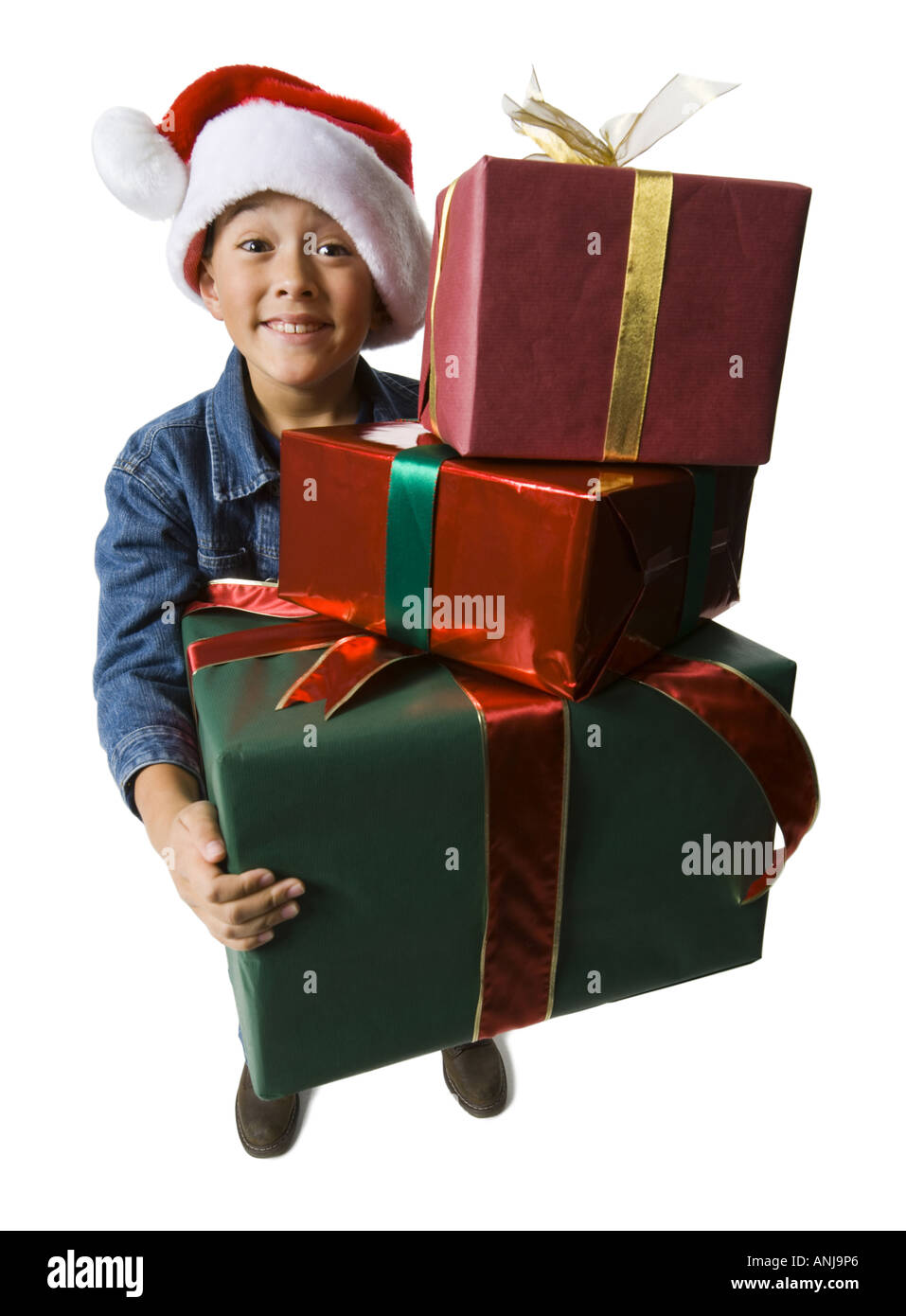 Portrait of a boy holding Christmas presents Stock Photo