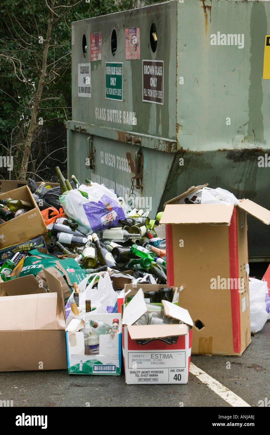 A full bottle bank overflowing with bottles to be recycled Ambleside UK