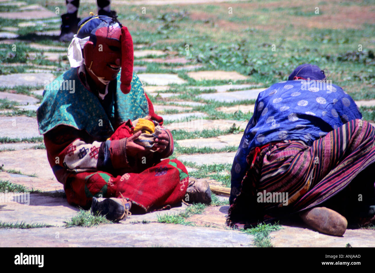 These monks dressed in costumes and headgear are part of a religious