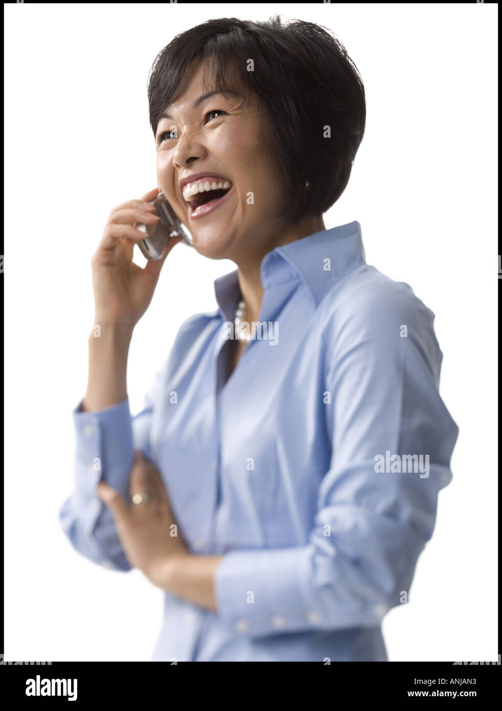 Close up of a mid adult woman talking on a mobile phone Stock Photo