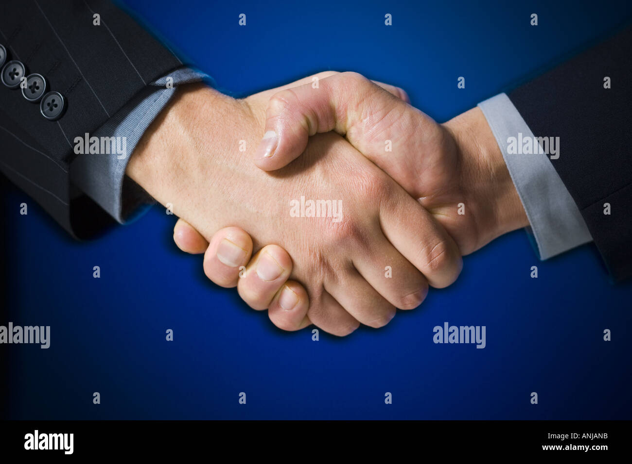 Close up of two businessmen shaking hands Stock Photo