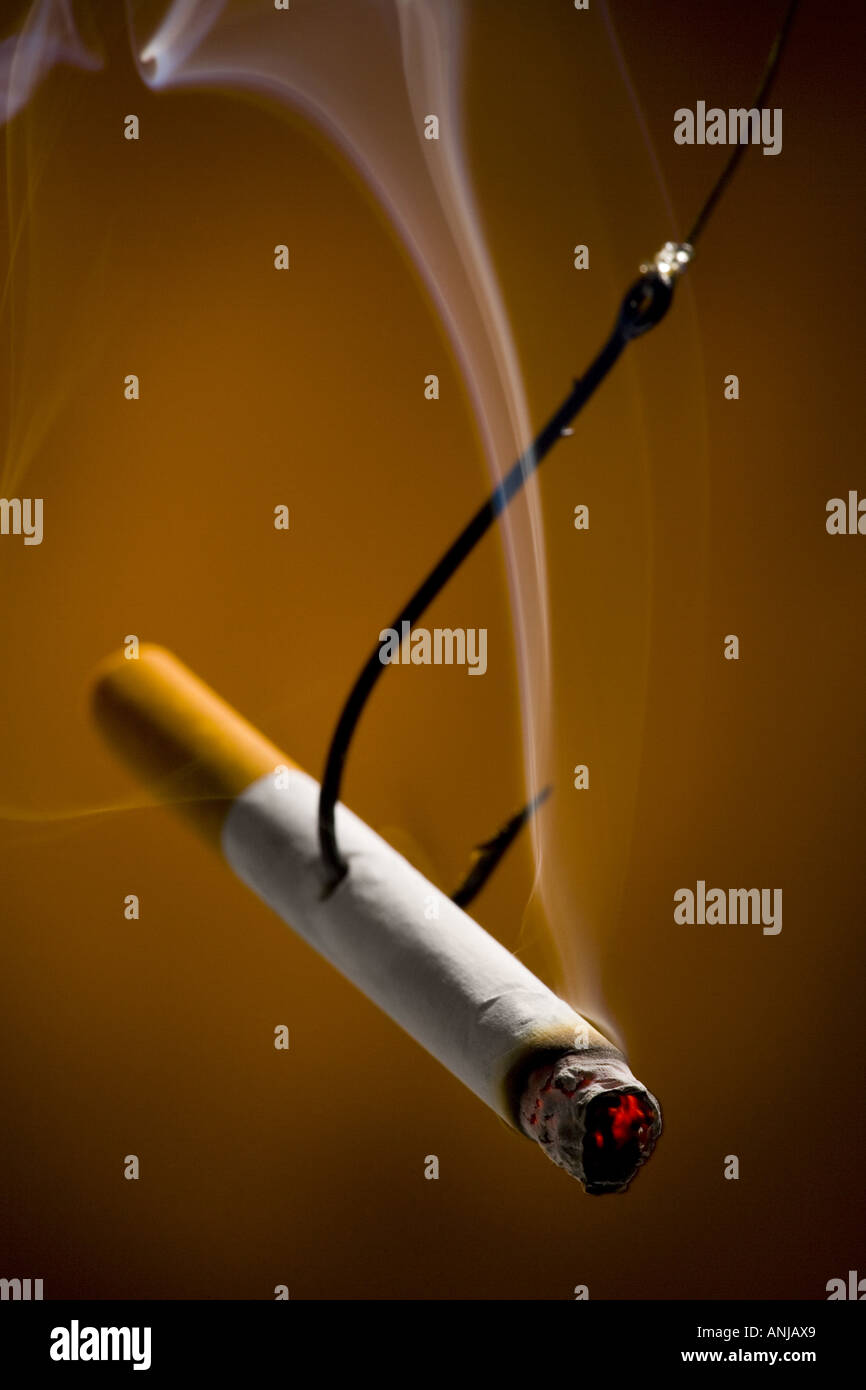 Close up of a burning cigarette on a fishing hook Stock Photo