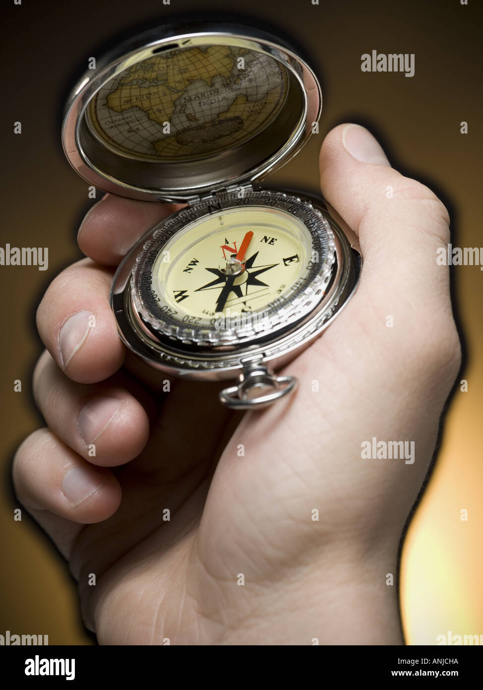 Close up of a person holding a compass Stock Photo