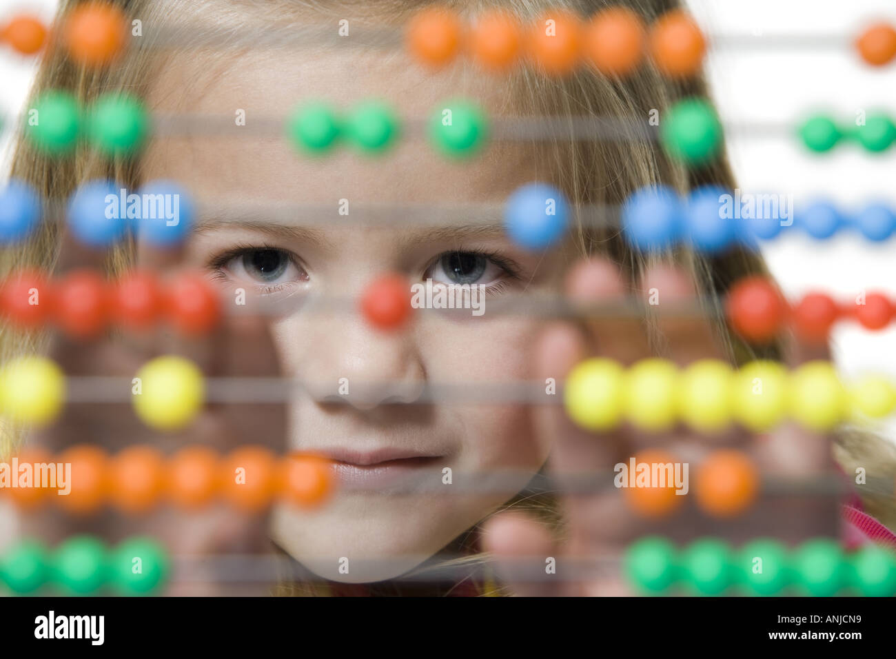 Portrait of a girl using an abacus Stock Photo