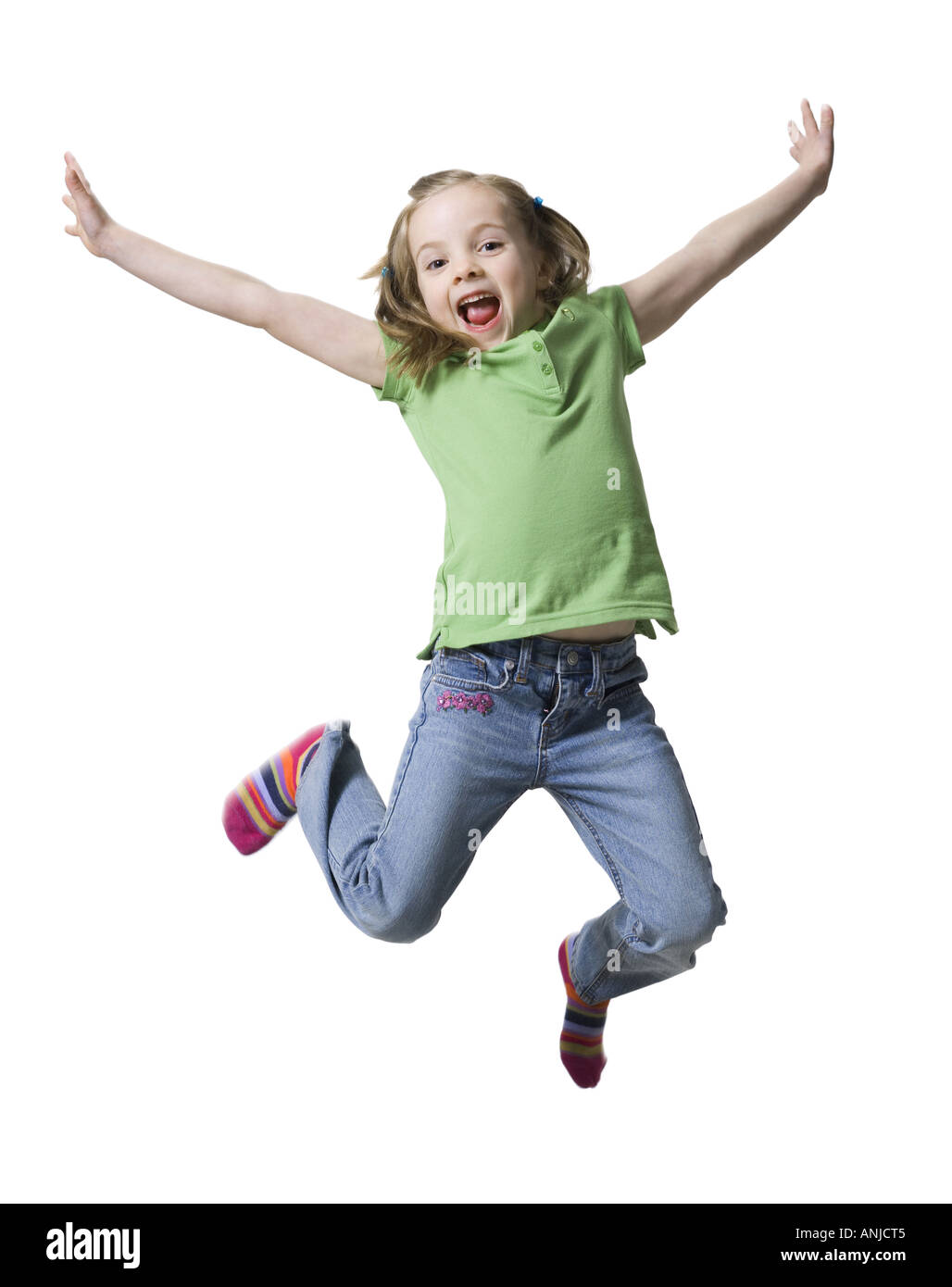 Portrait of a girl jumping in mid air Stock Photo - Alamy