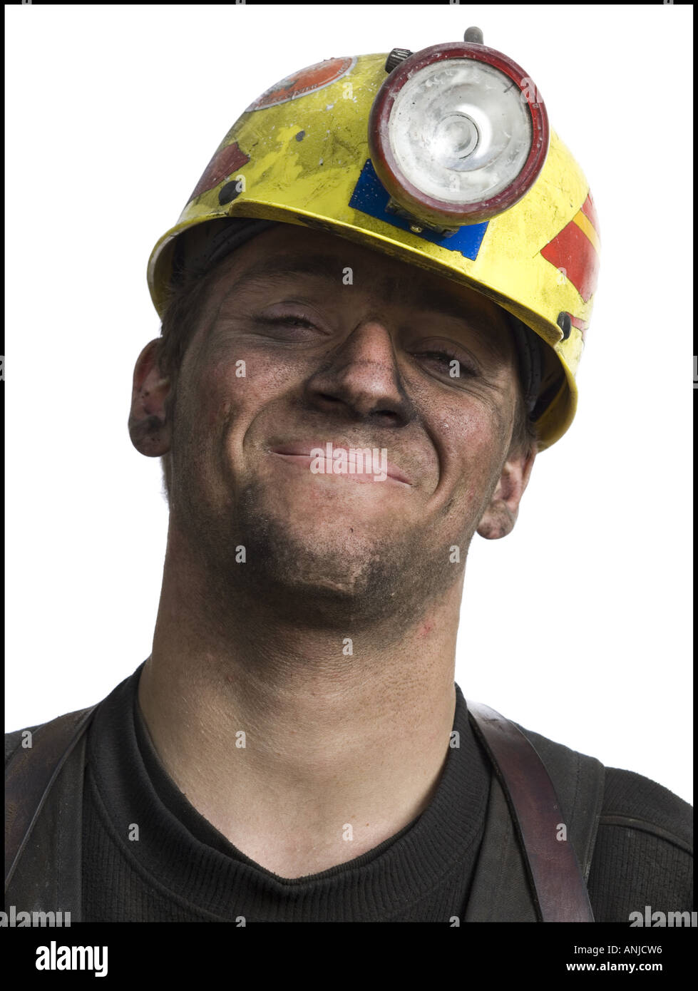 Portrait of a miner wearing a hardhat with a headlamp Stock Photo