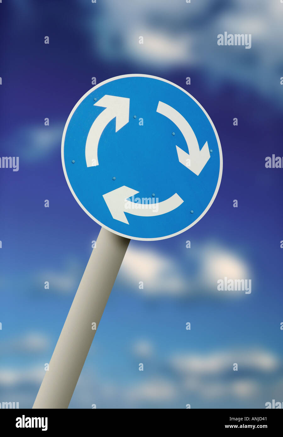 road sign of arrows going around in circles symbol for a round about Stock Photo
