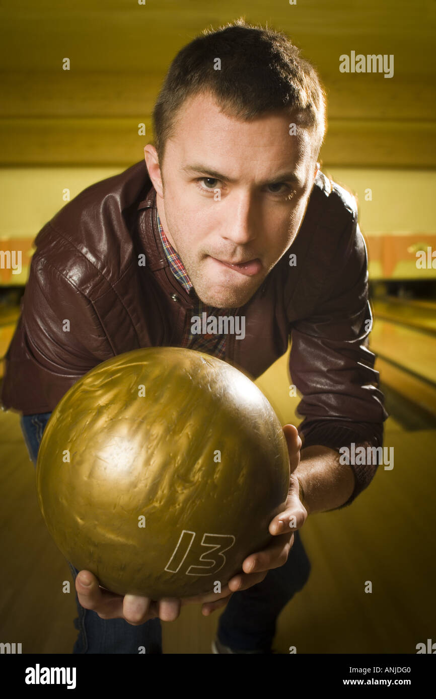 Close up of a young man at a bowling alley Stock Photo