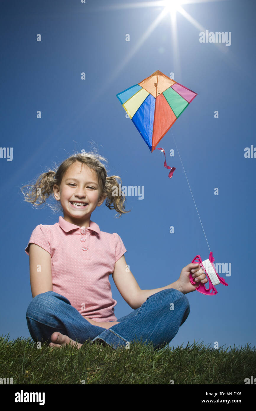 Portrait of a girl flying a kite Stock Photo